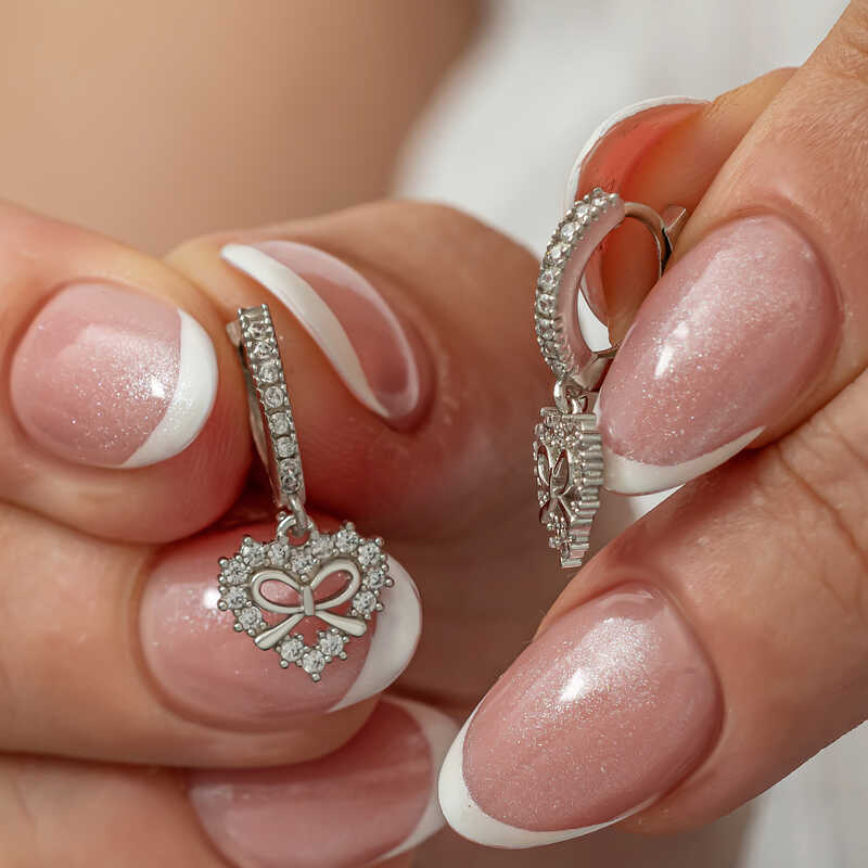 Gümüş Kalp Kurdele Sallantılı Kadın Küpe Gümüş Kalp Kurdele Sallantılı Kadın Küpe